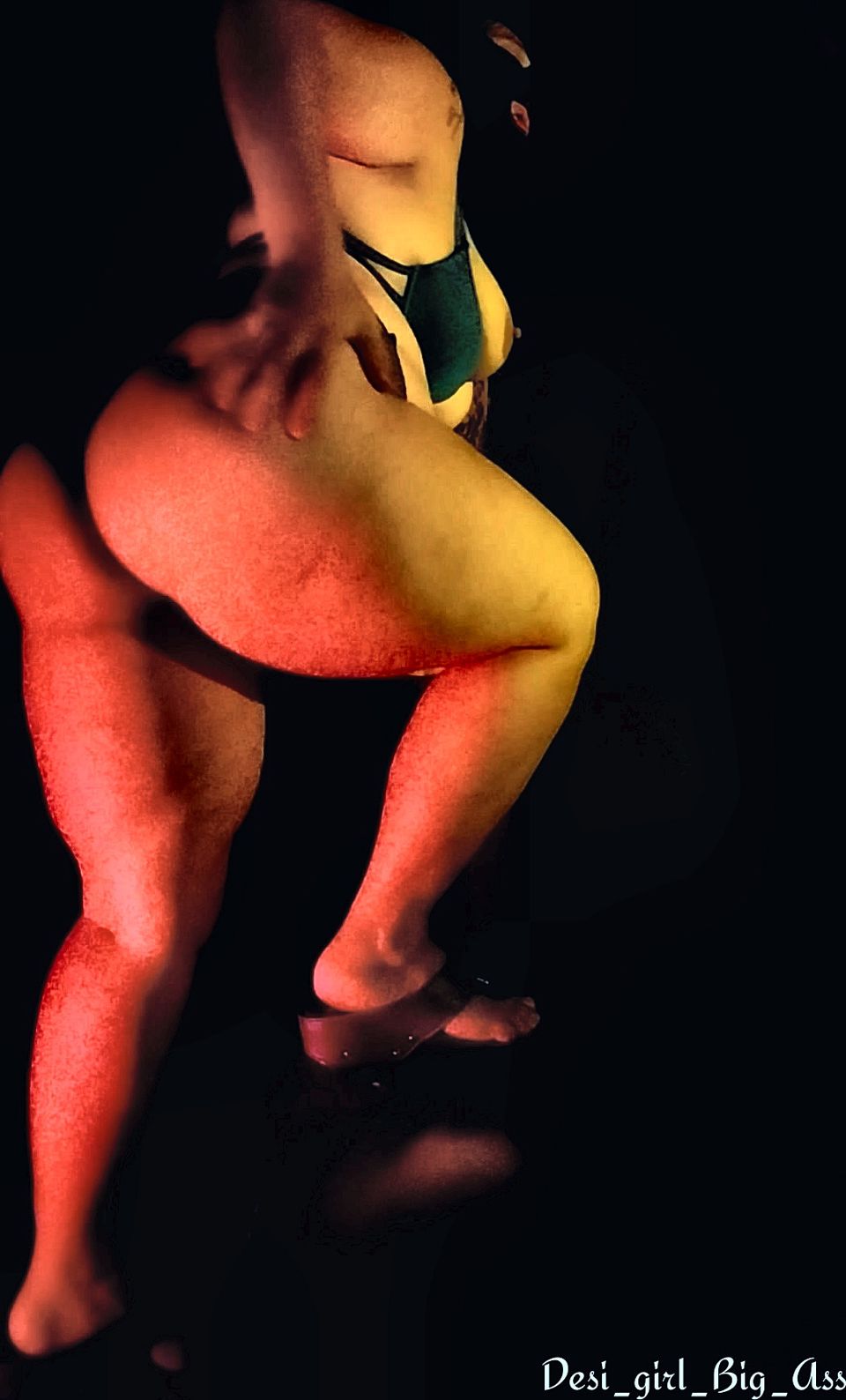 An Indian couple having intense sex in a dark room.