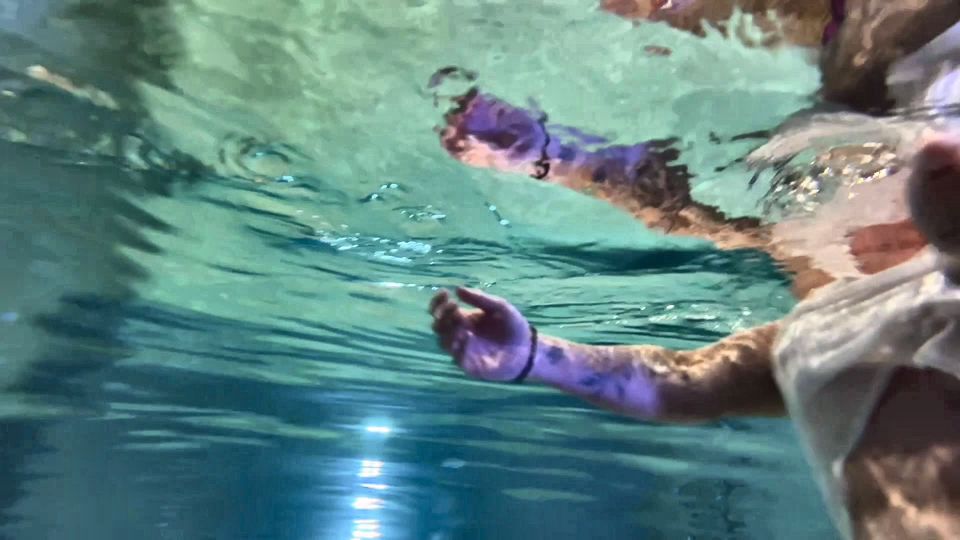 Amazon Kandy Flexes Her Massive Biceps in Her Hotel Pool