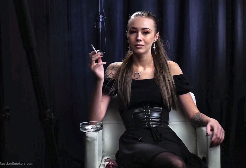 Brunette Girl Is Giving an Interview About Her Smoking Experience