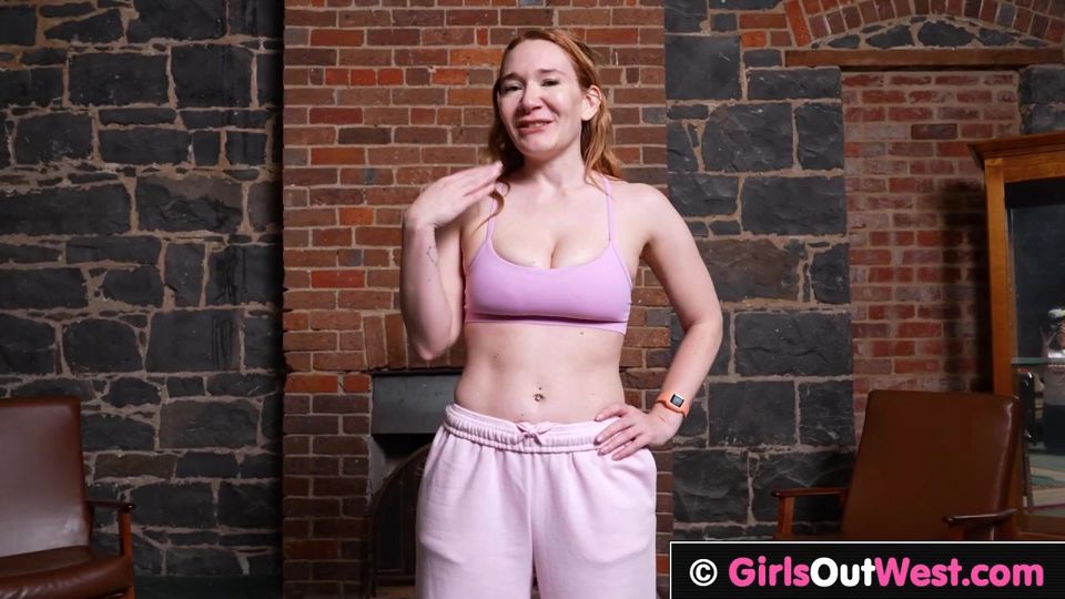 Busty redhead pulls her panties aside to finger her cunt