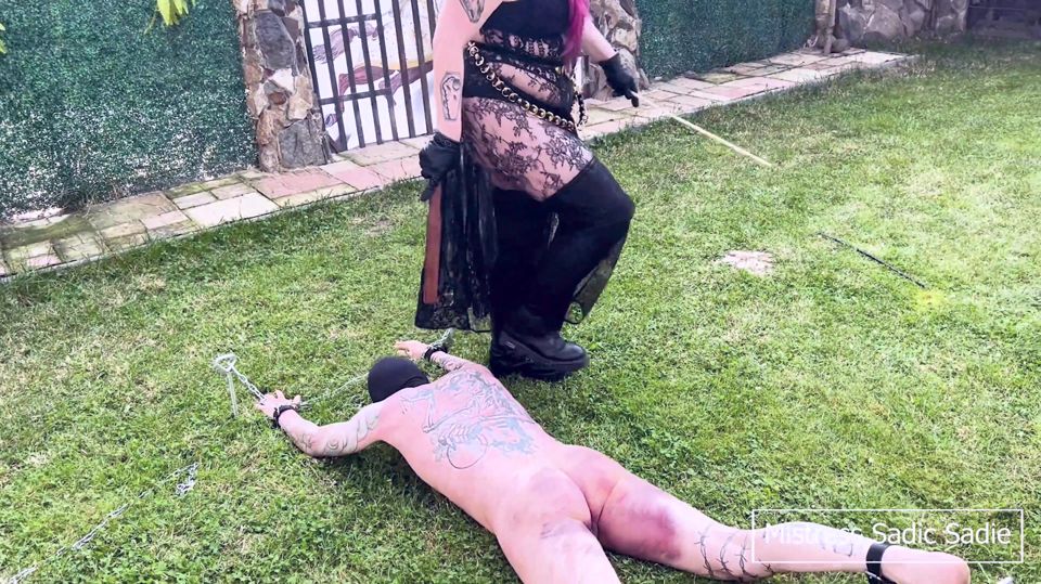 Double Female Domination with Already Heavy Bruised Slaven Who Receives More Corporal Punishment Outside in the Sun.