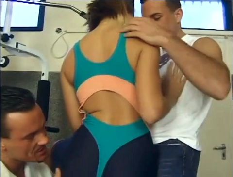 Sexy butt blonde slut fucks and sucks two hard cock in gym