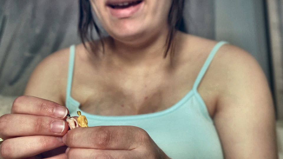 Giantess Girl Unwraps a Candy but Is Surprised Because There Is a Tiny Man in the Candy Bag - She Is Curious to See What It