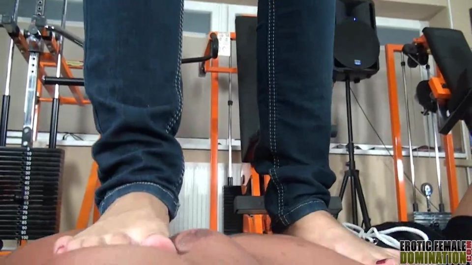 Slave gets trampled by his petite brunette Mistress