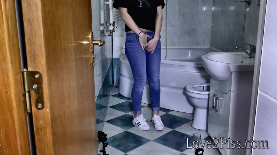 Filling a jar with her golden liquid and pipi accident in the bathroom