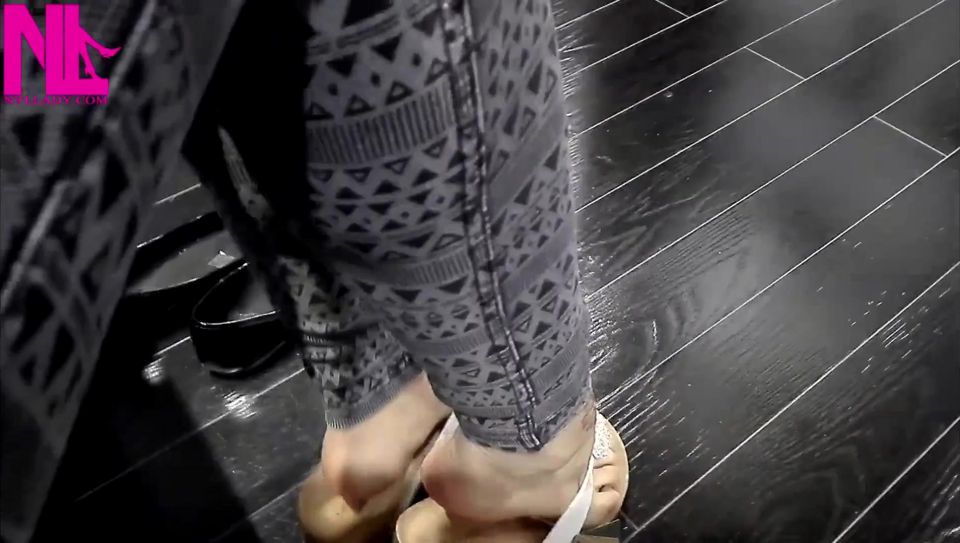Shoeplay and Dangling in Cute White Flip Flops in a Store