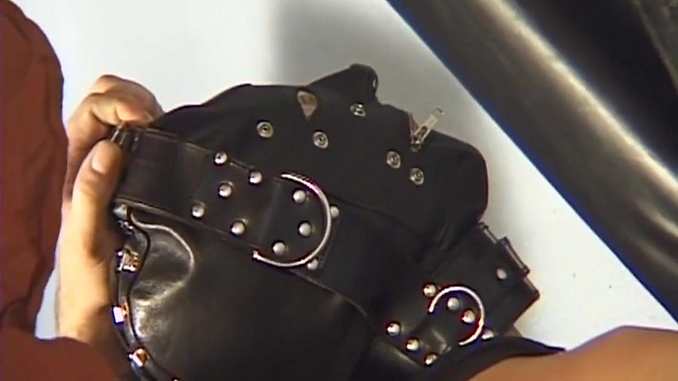 Corseted MILF in Mask Serves Hooded Masters Eagerly