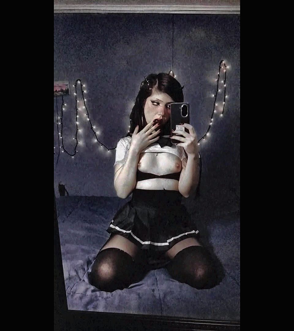 Gothic girl dressed as a Japanese schoolgirl with small tits and beautiful nipples