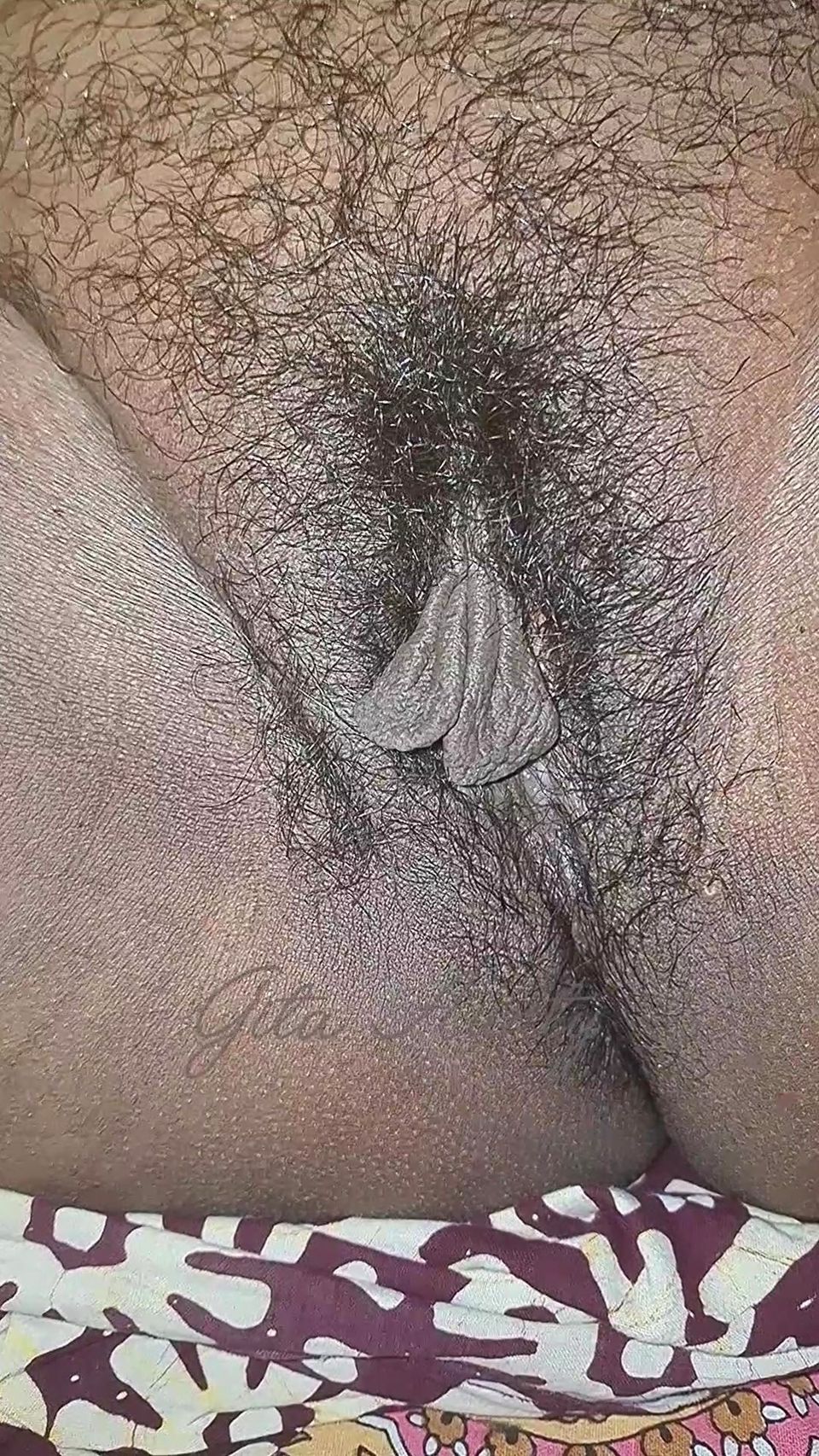 The village woman is showing her large pussy
